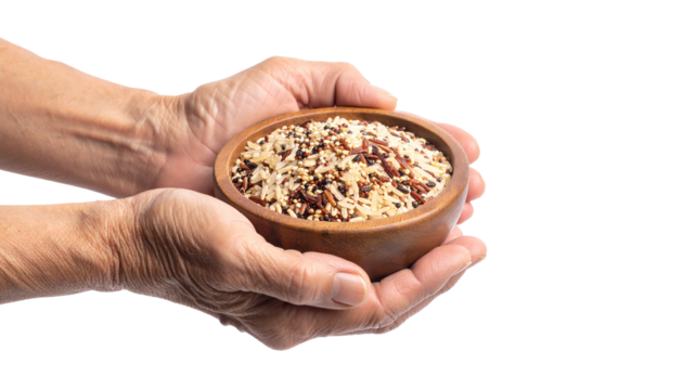A pair of hands cradles a wooden bowl filled with colorful grains, emphasizing healthy eating and natural ingredients