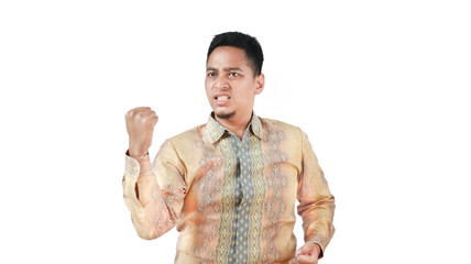 Man Showing Aggression While Celebrating Success in Traditional Attire