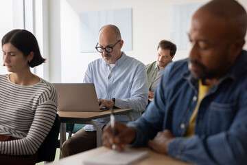 Focused Classroom with Students at Their Laptops