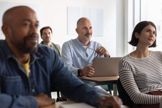 Lifelong Learner listening to tutor in a class
