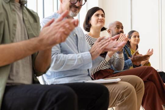Audience Clapping and Appreciating a Presentation