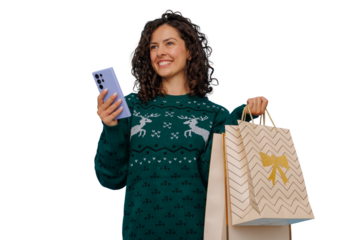 Happy woman holding shopping bags and mobile phone, finding christmas gifts online, transparent background