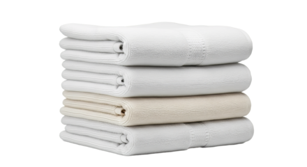 Soft cotton towels neatly stacked on a surface ready for use in a bathroom or spa setting