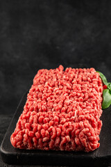 Raw minced meat beef pork ground meat natural product tasty snack fresh delicious gourmet food background on the table rustic top view copy space
