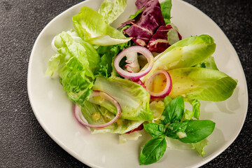 Chicory salad green leaf mix vegetables dish natural product tasty snack fresh delicious gourmet food background on the table rustic top view copy space keto and paleo diet vegan and vegan food