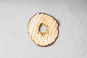 Apple slices on a light gray background.