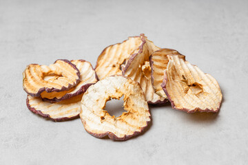 Apple slices on a light gray background.