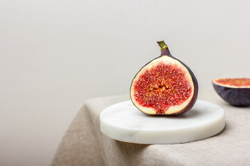 Fresh cut figs on a light background.