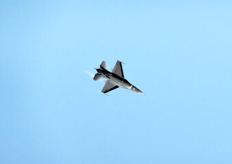 Flight of a military jet fighter F-16