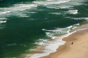 Two fishermen at the Atlantic coast in Portugal.