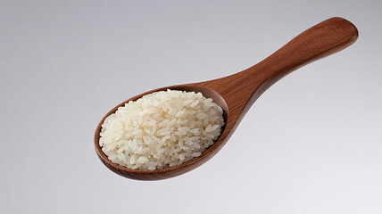 Harvested grains of pure white rice fill a smooth wooden spoon, ready for delicious culinary creations and healthy meals.