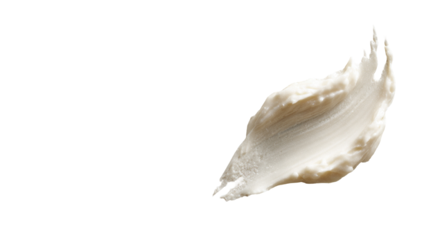 Creamy, off-white substance, smudged in a soft, irregular shape against a black background.  