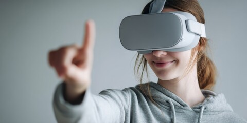 Young woman with virtual reality headset engages in immersive digital experience, smiles while reaching out in futuristic environment