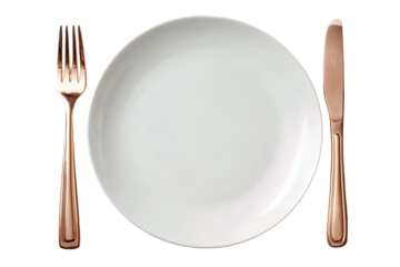 Empty white plate with copper-colored fork and knife