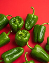 Vibrant green peppers on red