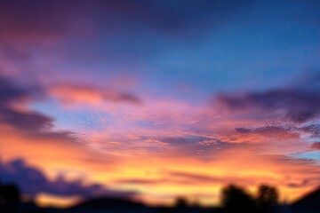Fototapeta premium Blurry sunset sky with colorful clouds