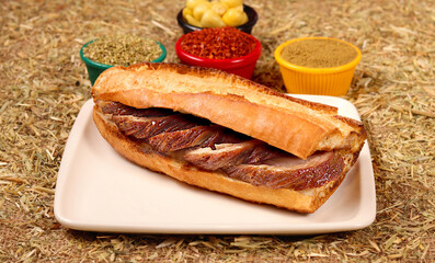 a photo of a fried kokorech sandwich,close up