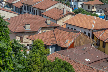 Top view of the tiled roofs of the old town. Kaleici is a quarter in Antalya, located in the Muratpasha district. Historical city center in Antalya. The narrow streets of the old town.