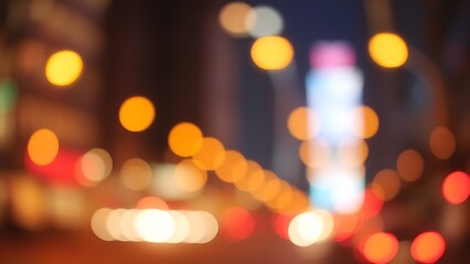 Warm abstract city lights create a dreamy urban nightscape with soft gradient tones.