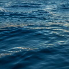 Close-up of Blue Ocean Water Surface with Gentle Waves and Sunlight image photo