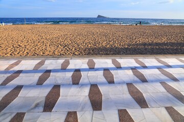 Benidorm city marble flagstone tiled sidewalk pattern on Levante Beach promenade. Benidorm town in Valencian Community (Comunidad Valenciana), Spain.