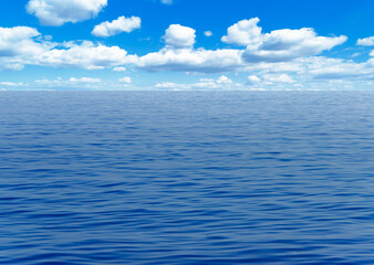 Obraz premium A wide view of the calm blue ocean stretching to the horizon under a bright sky with scattered white clouds.