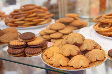 Tasty sweet cookies on the window of confectionery store