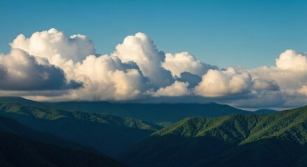 Obraz premium Panoramic mountain vista with cumulus clouds