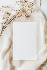 Vertical card mockup on elegant minimalist background. Aesthetic scene with dry flowers and fabric.