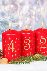Fourth 4th Sunday in advent Christmas time copyspace copy space with burning candle snow winter