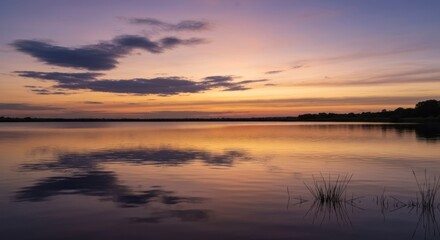 Tranquil lake sunset reflection
