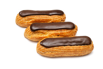 French eclairs with chocolate glaze on a white background