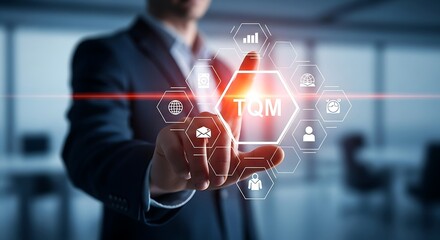 Man in suit points to TQM hexagon with icons on futuristic digital interface total quality management