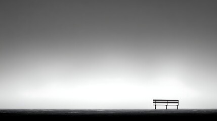 Empty Park Bench Silhouette on Gray Sky in Minimalist Landscape