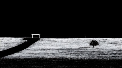 Black and White Landscape Scene with Tree and Bench on Hilltop