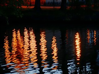 Abstract Night Water Reflection: Glowing Orange Lights on Rippling Surface