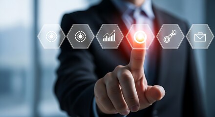 Businessman touching a glowing hexagon with a circular icon on a digital interface hand finger