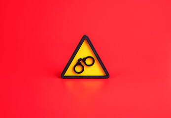 Symbol of arrest. Handcuffs. Detention or imprisonment. Sanctions and restrictions of rights....