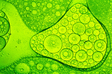 Close-up macro green drink bubbles,Water wave, close up of vibrant green liquid with bubbles,...