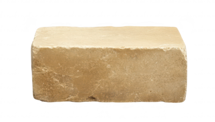 A single. unadorned beige stone block resting on a white background. its natural texture and color. suitable for use in construction. art. or design projects