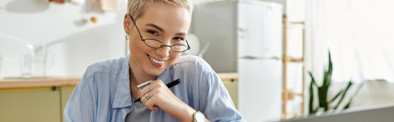 Young woman enjoying a moment of creativity in her cozy home workspace