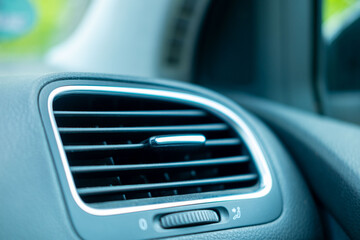 close-up sleek car air vent with chrome trim, set against blurred interior background, Climate comfort, vehicle technology, modern automotive design and climate control features