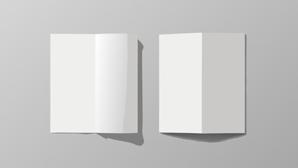 Two blank white folded brochures or flyers on a gray background