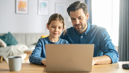 Father and daughter sitting at a desk, looking at a laptop. Two generations using technology together