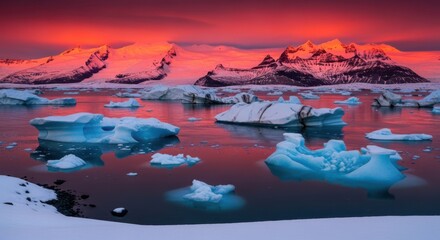Dramatic sunset over glacial lagoon with icebergs