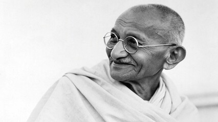 Mahatma Gandhi's Reverie: A dignified portrait of a person with spectacles, lost in thought, exuding an aura of serene wisdom and quiet contemplation.
