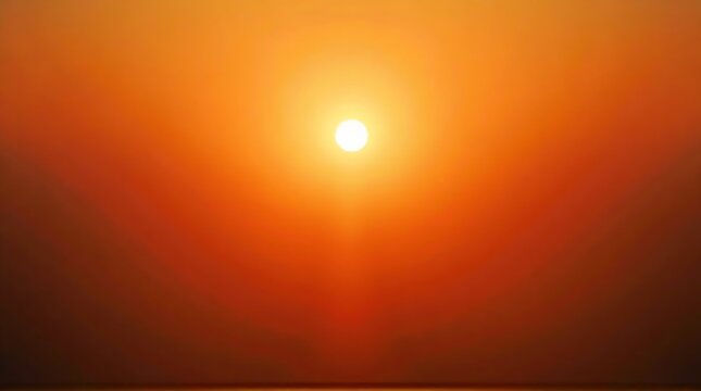 Vibrant Orange and Red Sunset over a Calm Body of Water