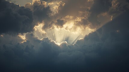A dramatic sky filled with dark clouds, revealing shafts of golden sunlight piercing through the dense formations.