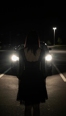 Gothic young woman in lace top and skirt, dramatic silhouette framed by harsh twin headlights in a dark parking lot, moody retro alternative style illustration