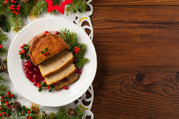 Small, baked patties in Christmas retro styling. Top view. Natural wooden background.